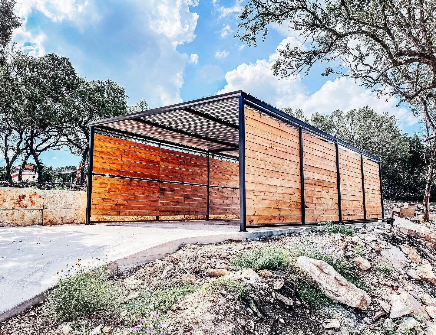 Custom steel and wood carport built on a Hill Country property