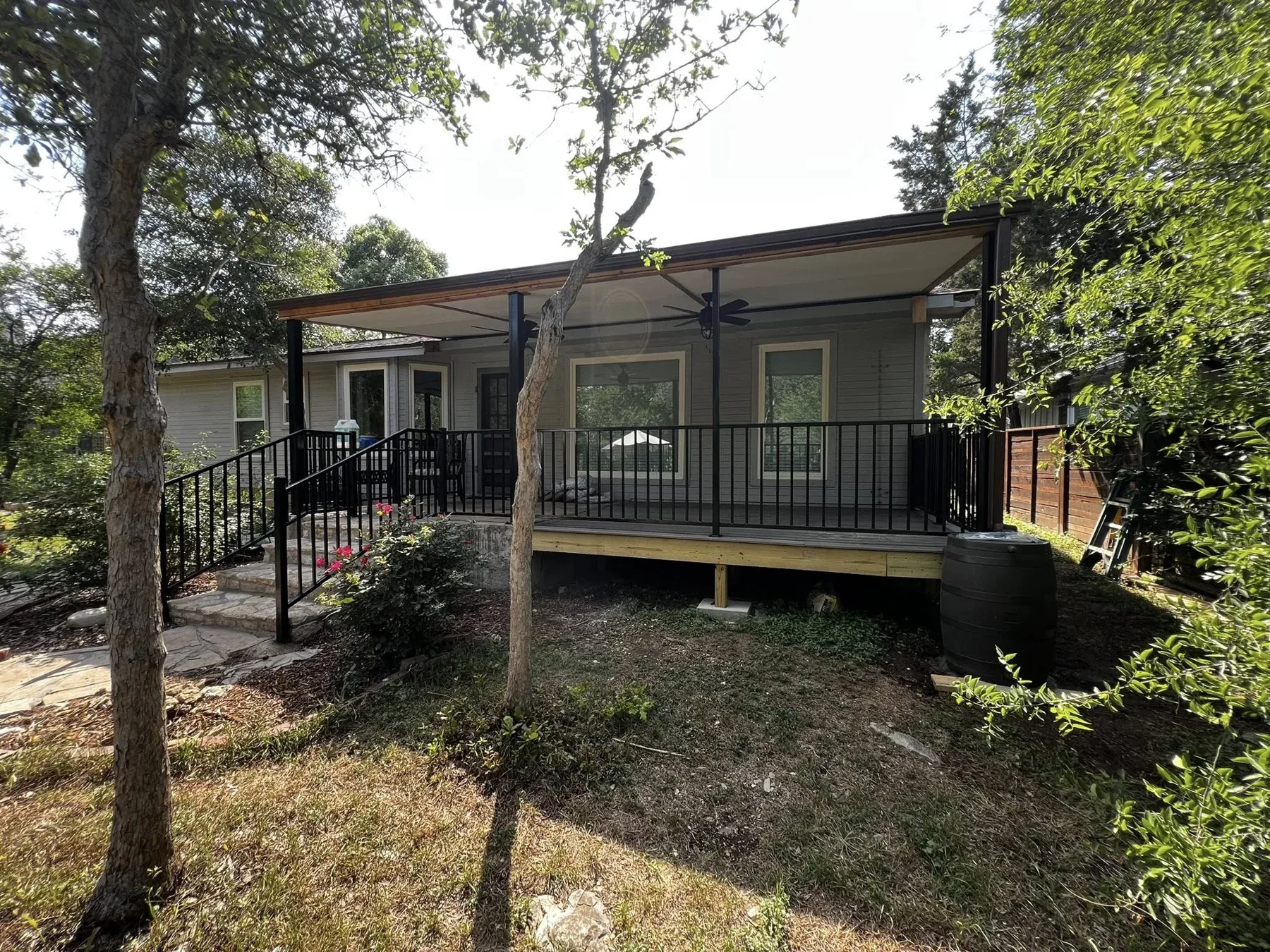 Covered composite deck with black railing