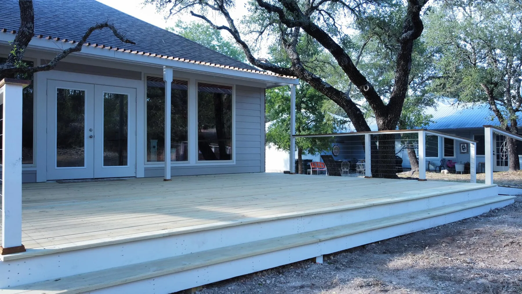 Custom Deck with Cable Railing by Love and Lumber Fence Co.