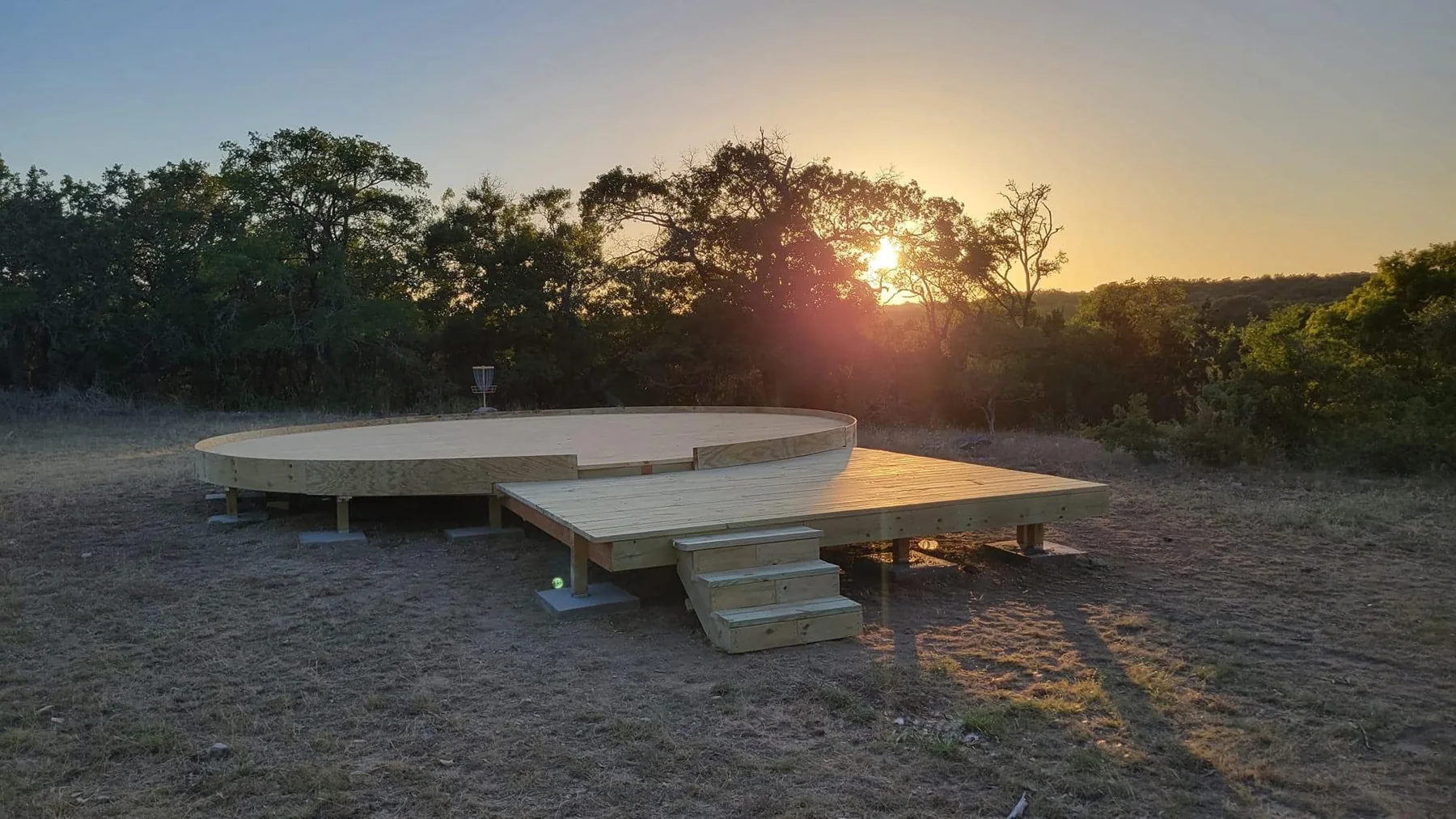 Custom round yurt deck at sunset