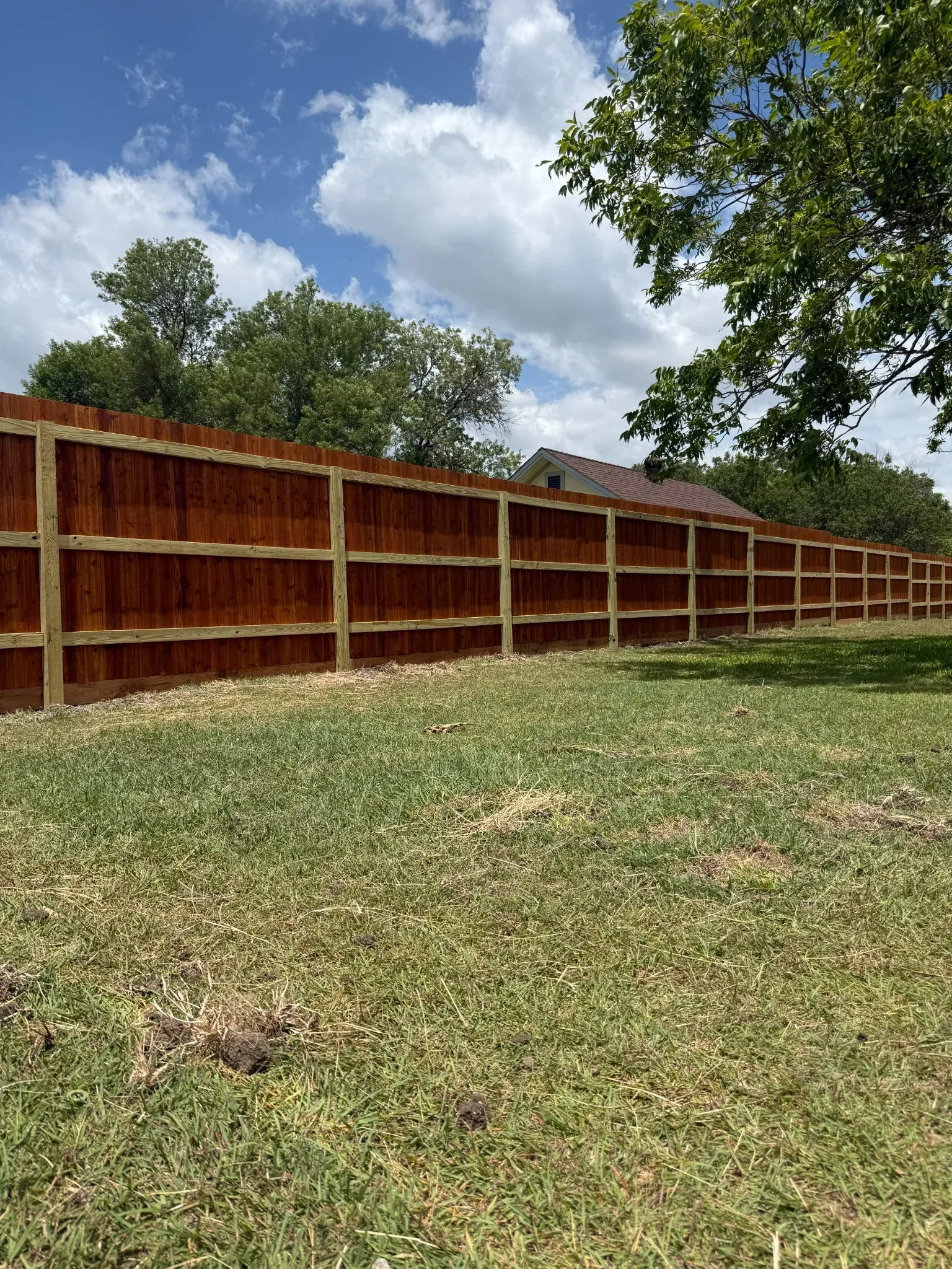 Finished cedar privacy fence built by Love and Lumber