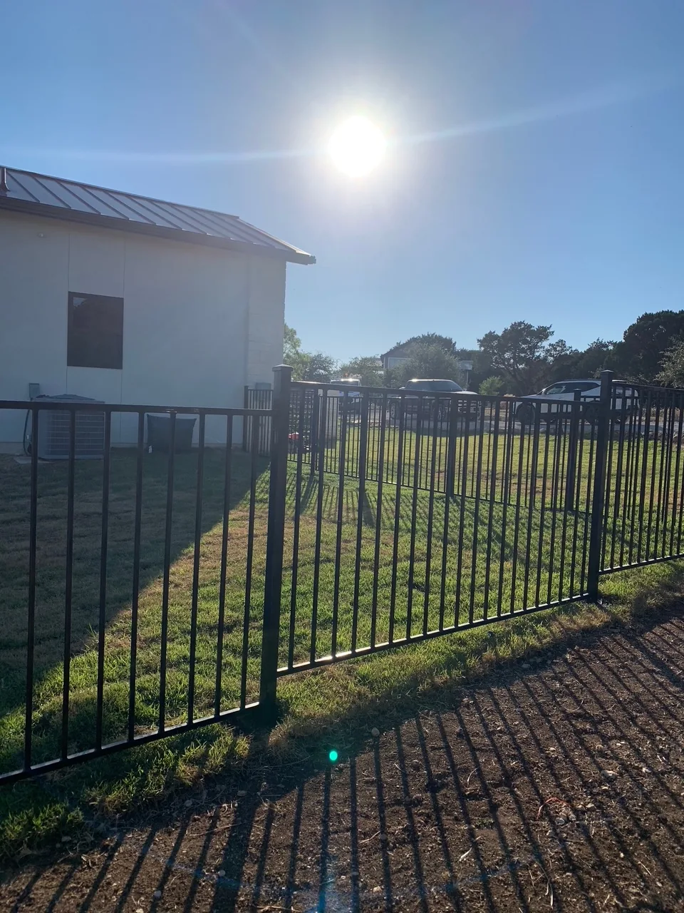 Black metal fence installation
