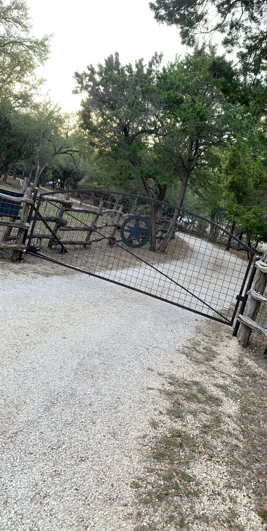 Custom steel driveway gate built by Love and Lumber