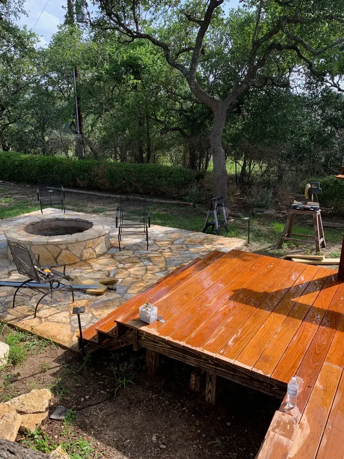 Finished hardwood deck stairs leading toward the outdoor area.