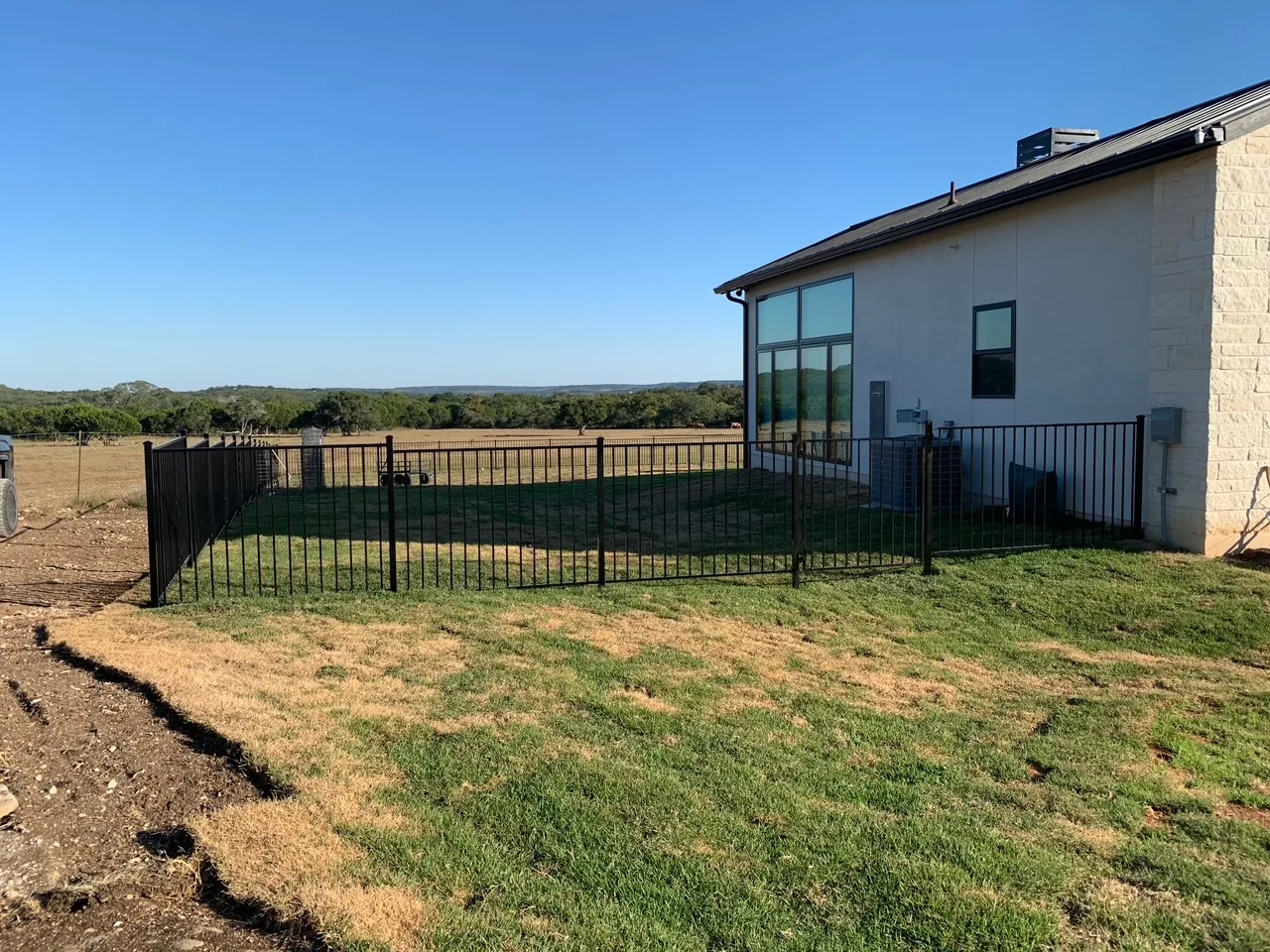 Completed ornamental fence and gate project by Love and Lumber Fence Co.