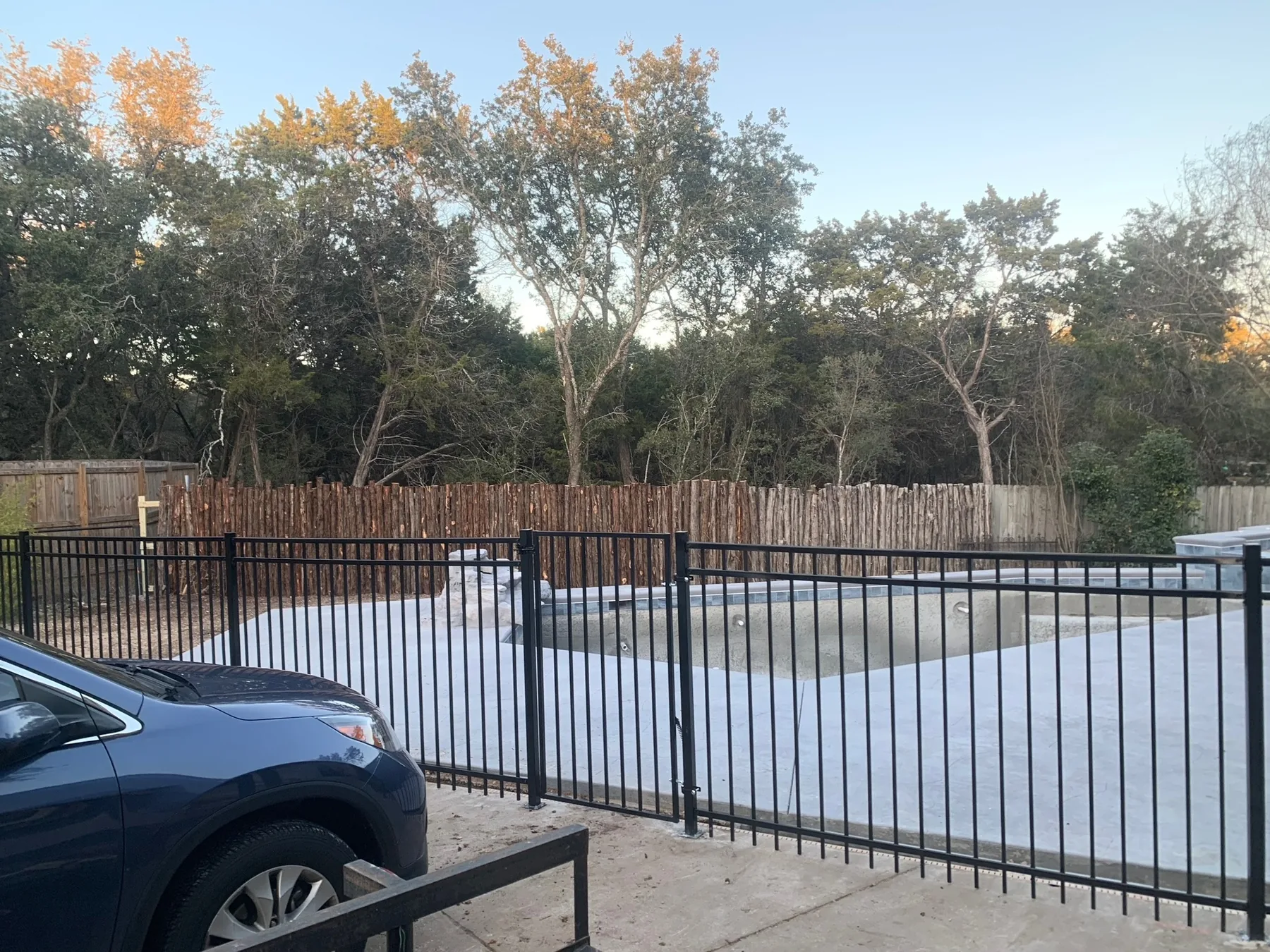 Second view of cedar pool-area fencing and outdoor space.